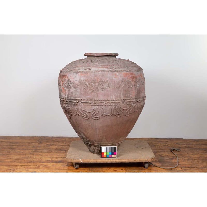Large Antique Indonesian Terracotta Water Jar with Wavy Patterns and Aged Patina