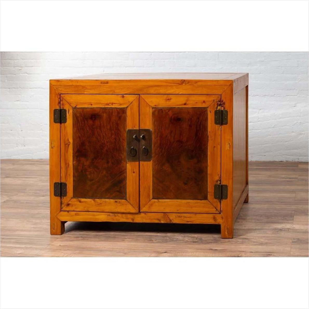 Two-toned burl and elm wood Chinese cabinet with doors, antique finish, photographed indoors.