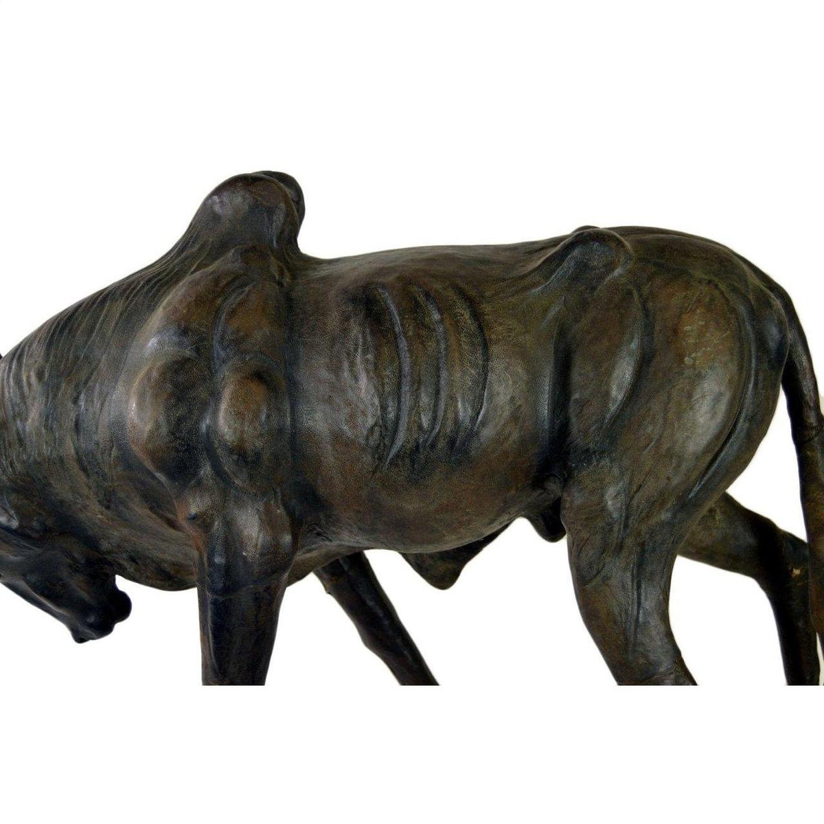 Brown leather gnu sculpture with visible ribs in a hunched walking pose, handmade, shown in good condition.