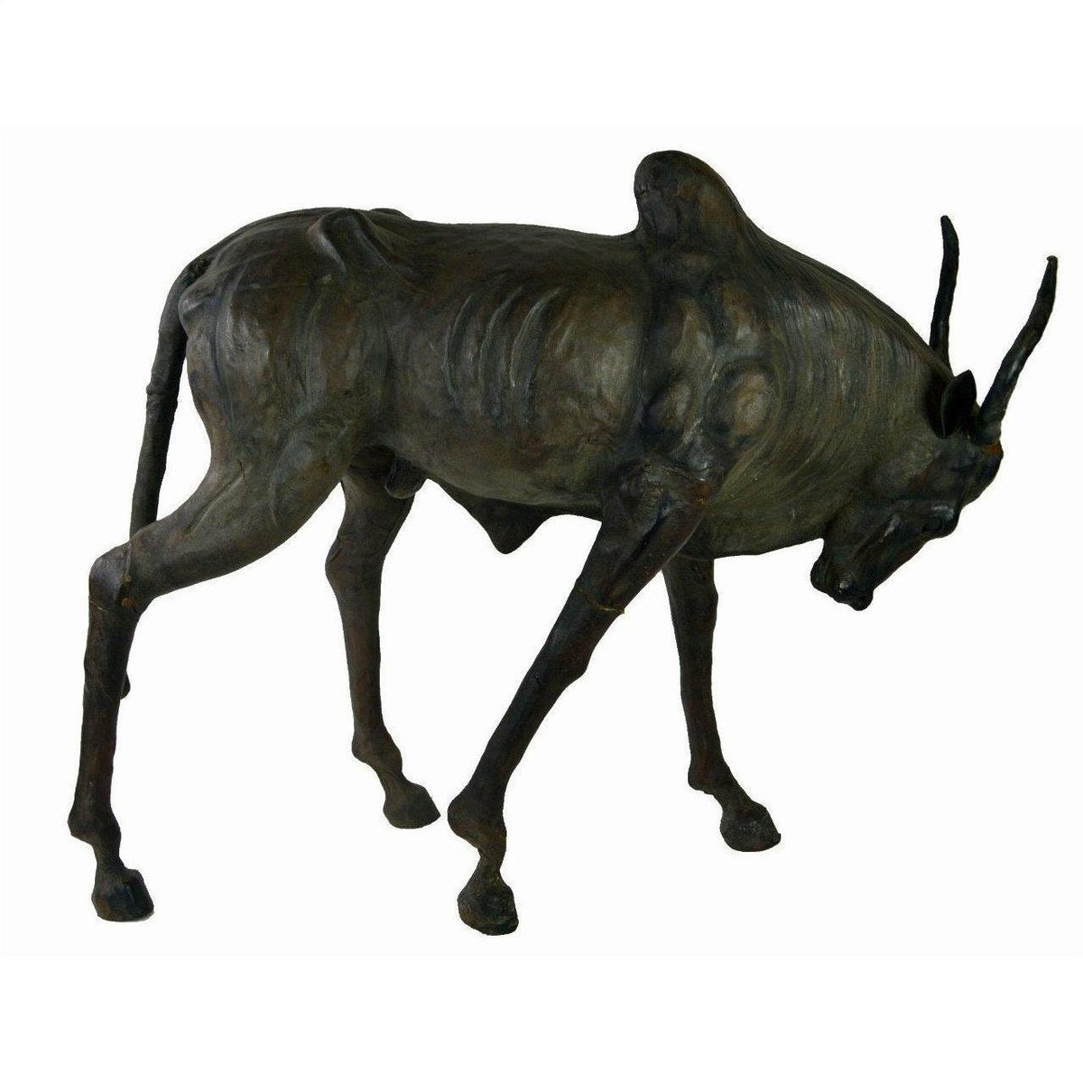 Brown leather gnu sculpture with thin body, curved horns, and lowered head, handmade, close-up view.