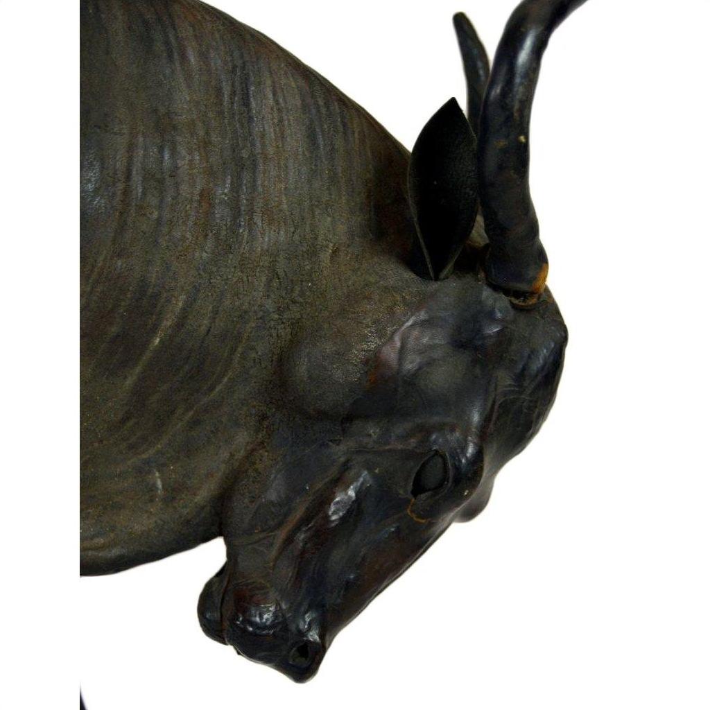 Close-up of a large leather gnu in good condition against a white background.