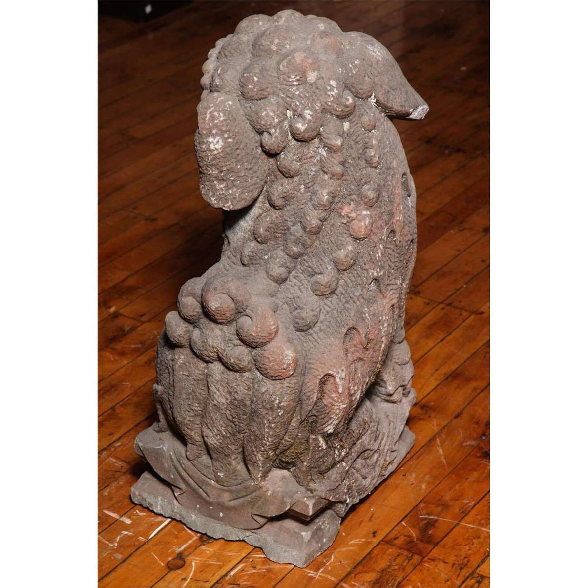 Stone lions, grey stone, textured coats, 16th-17th century China, Ming Dynasty style, set of two on display.