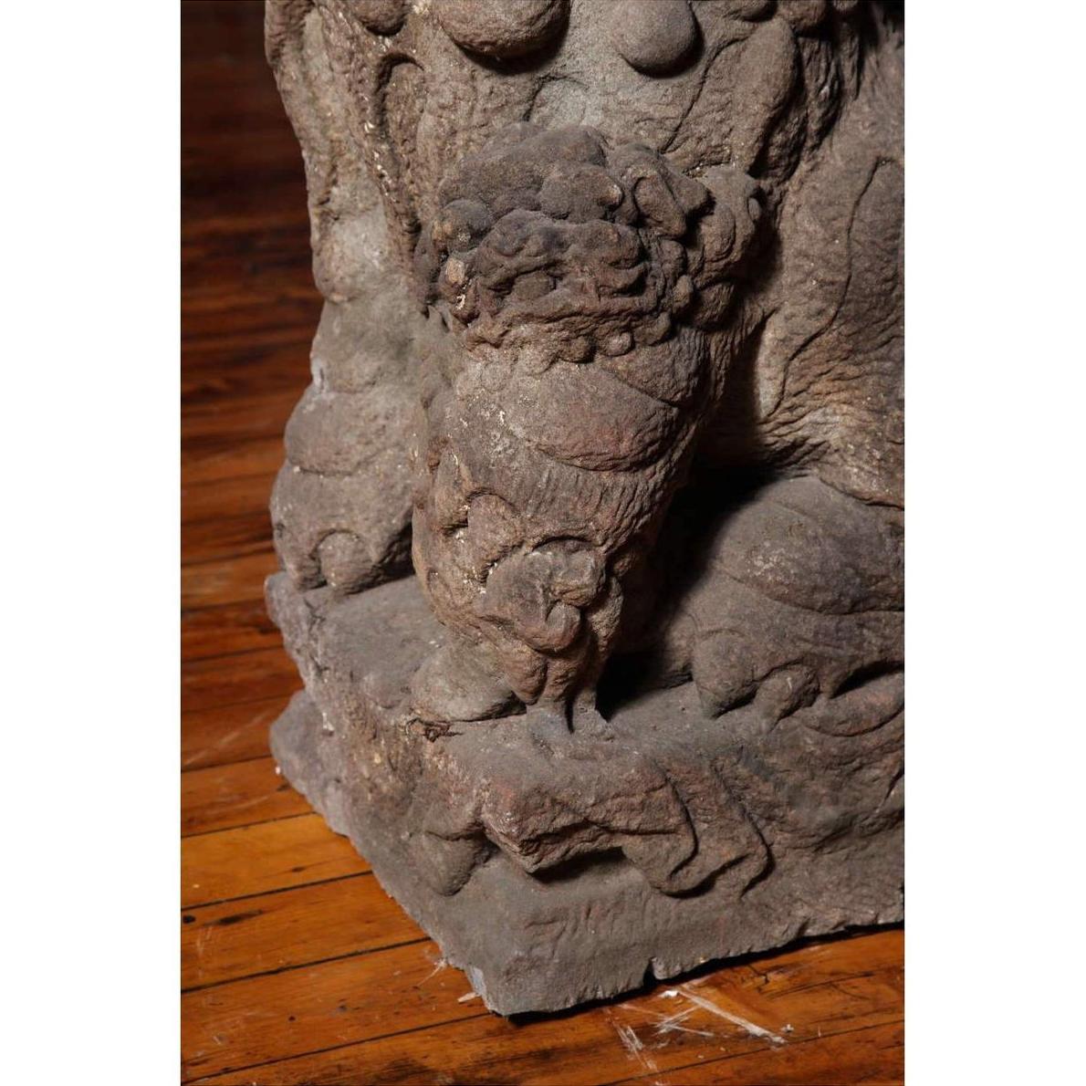 Close-up of gray stone lion's paw, Late Ming Dynasty, on textured base, China, 16th-17th century.