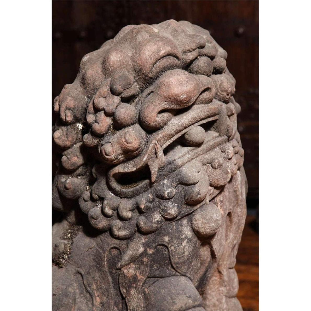 Close-up of weathered stone lion sculpture with intricate curls, gray color, Late Ming Dynasty, China, 16th-17th century.
