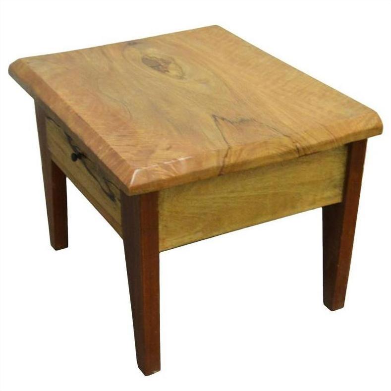 Natural finish mango wood side table with curved edges and front drawer featuring a brass pull, close-up view.