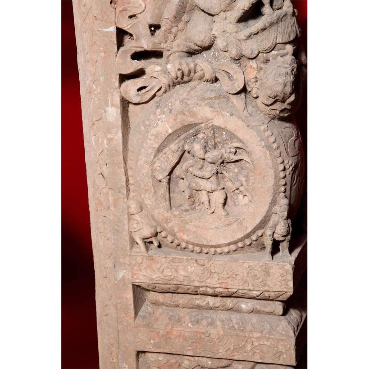 Brown wood Ming Dynasty Chinese temple carvings with figures, floral, and circular motifs on black bases, close-up.