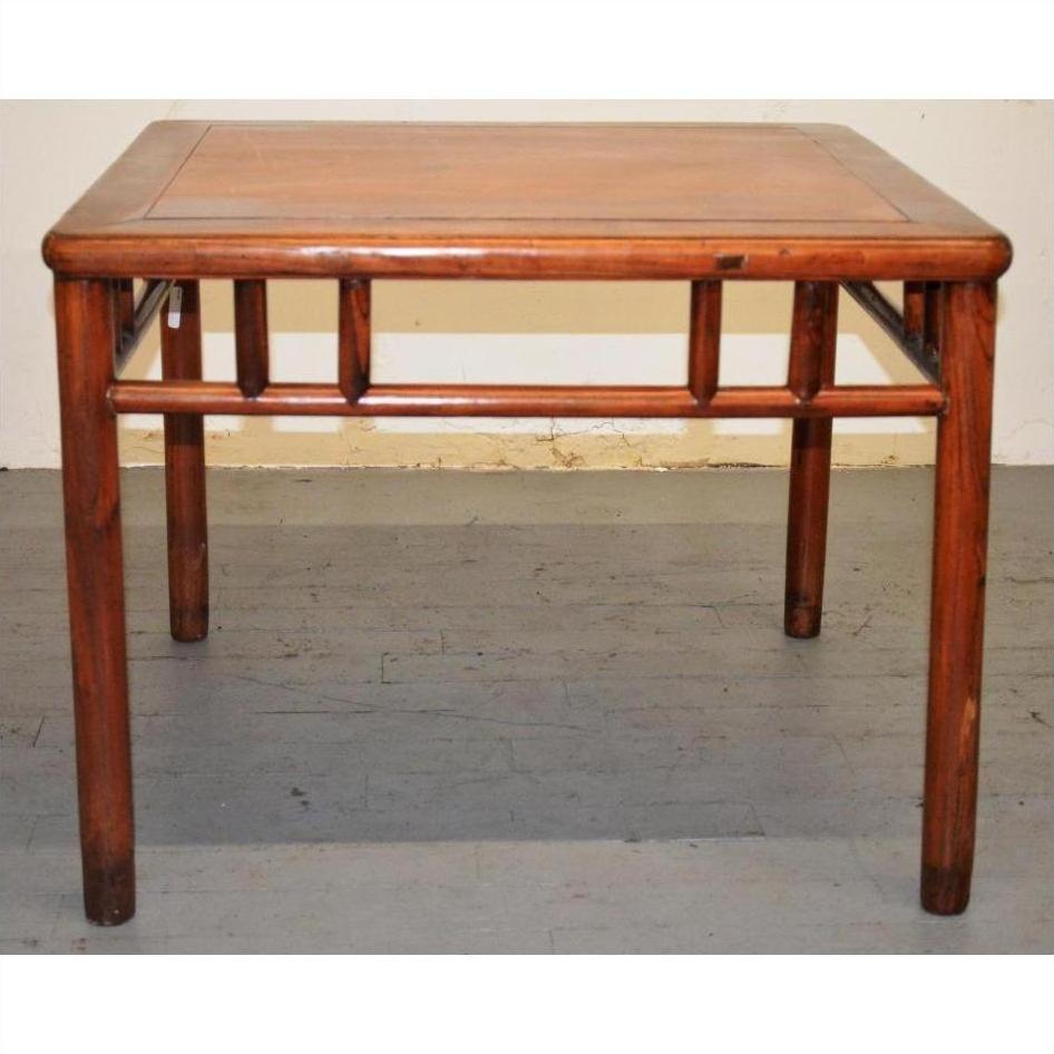 Square elmwood Ming style coffee or side table with rounded edges on a gray floor against a light wall.