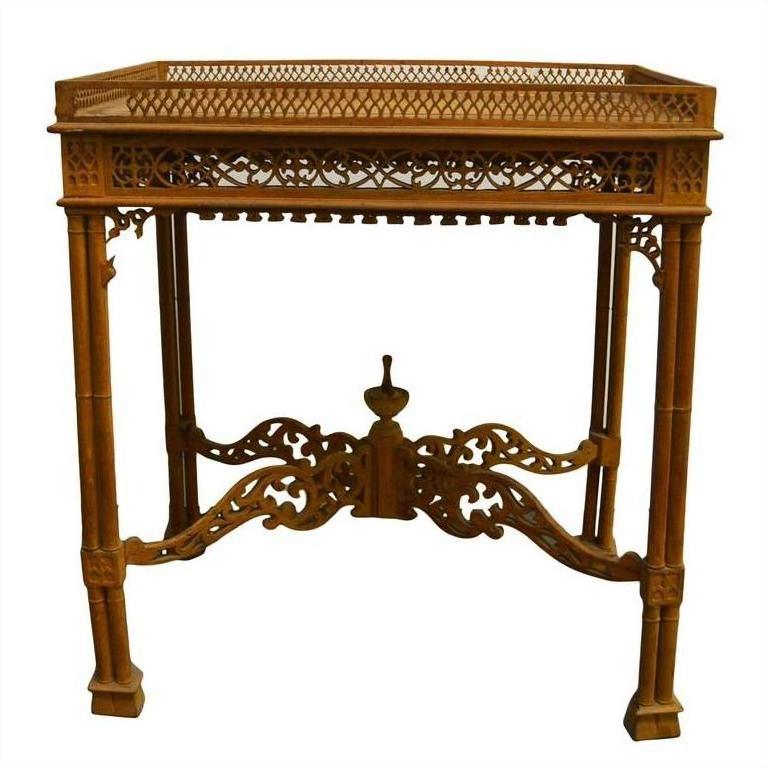 Brown wooden hand-carved table with lattice design and four straight legs, vintage style, indoor setting.