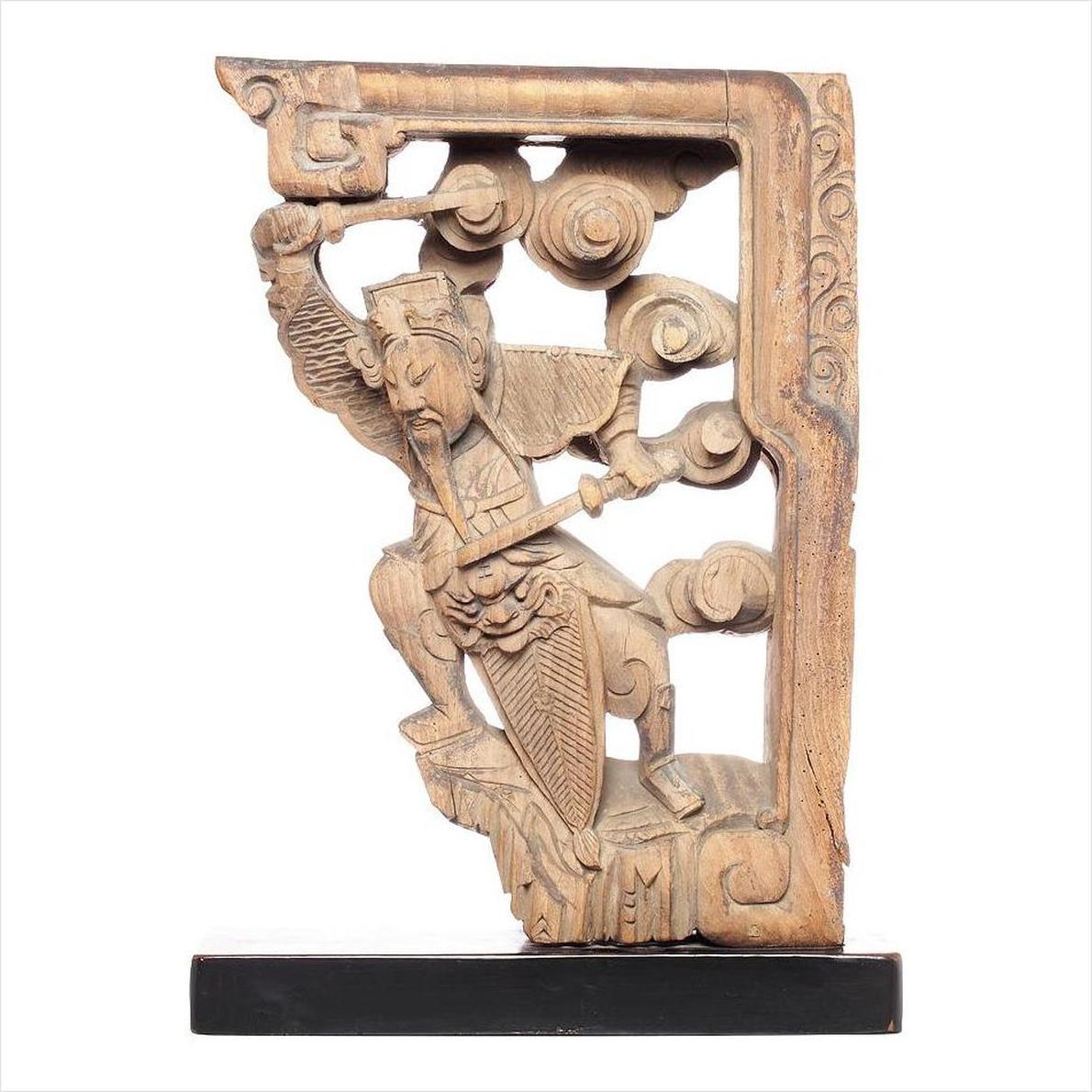 Brown wood hand-carved Chinese temple corbels with character figures and swirling cloud motifs, 18th century.