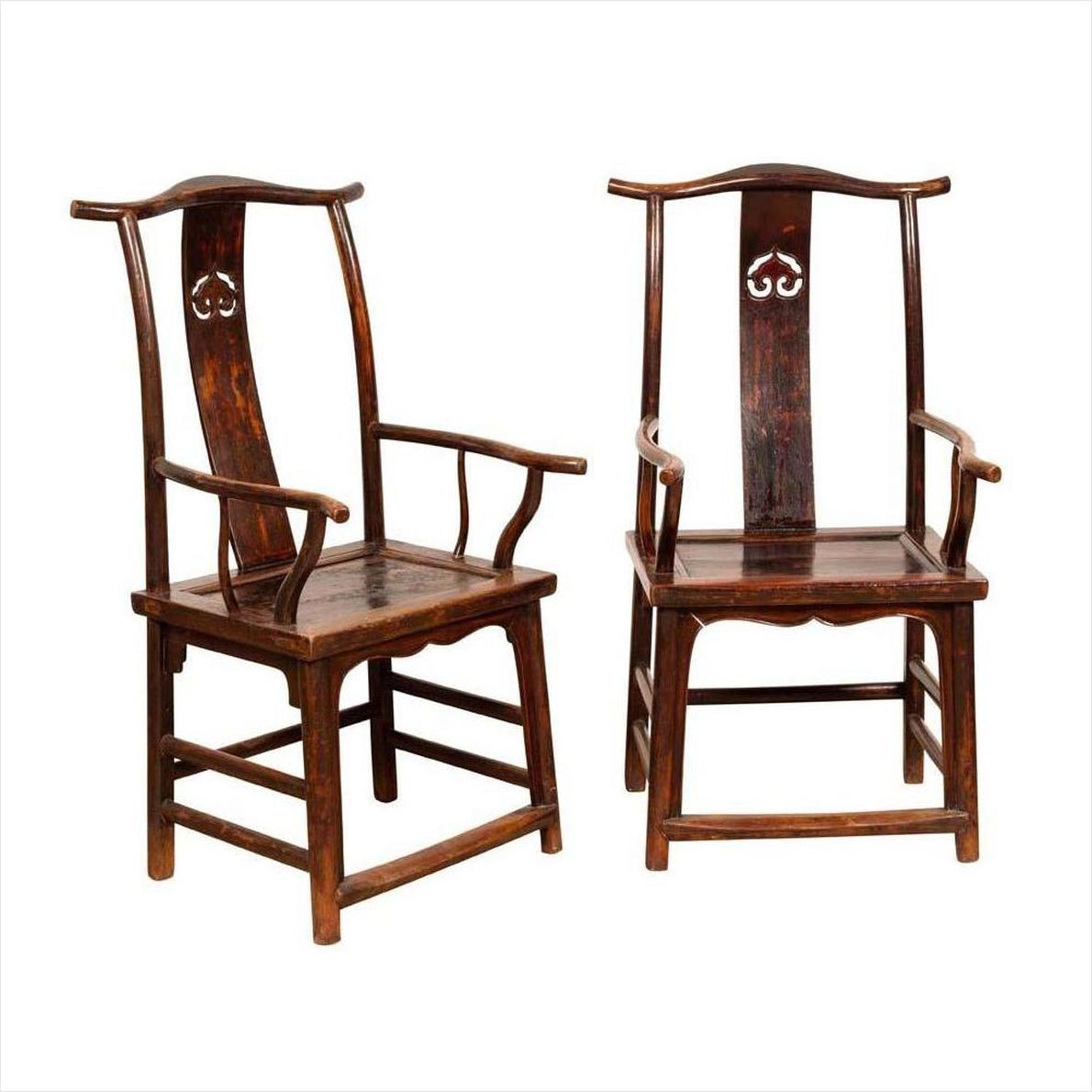 Brown wood Chinese Official's Hat Chairs from 1880s with carved splats and curved arms, side by side, front view.