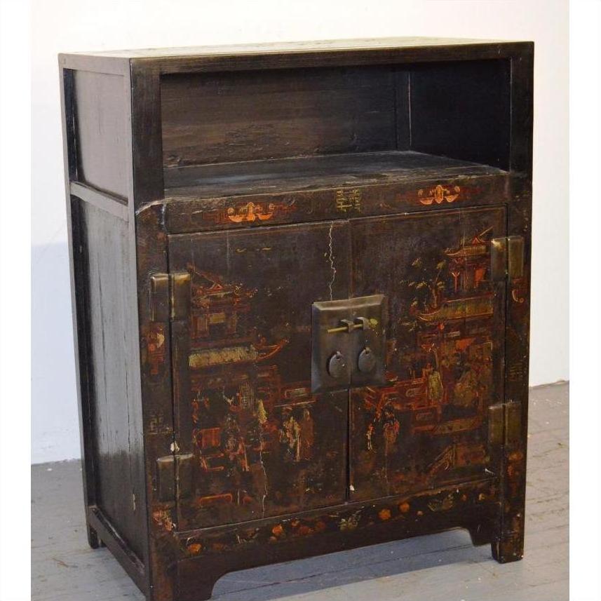 Brown wood display cabinet with painted motifs, two doors, brass handles, and open shelf top in antique Chinese style.