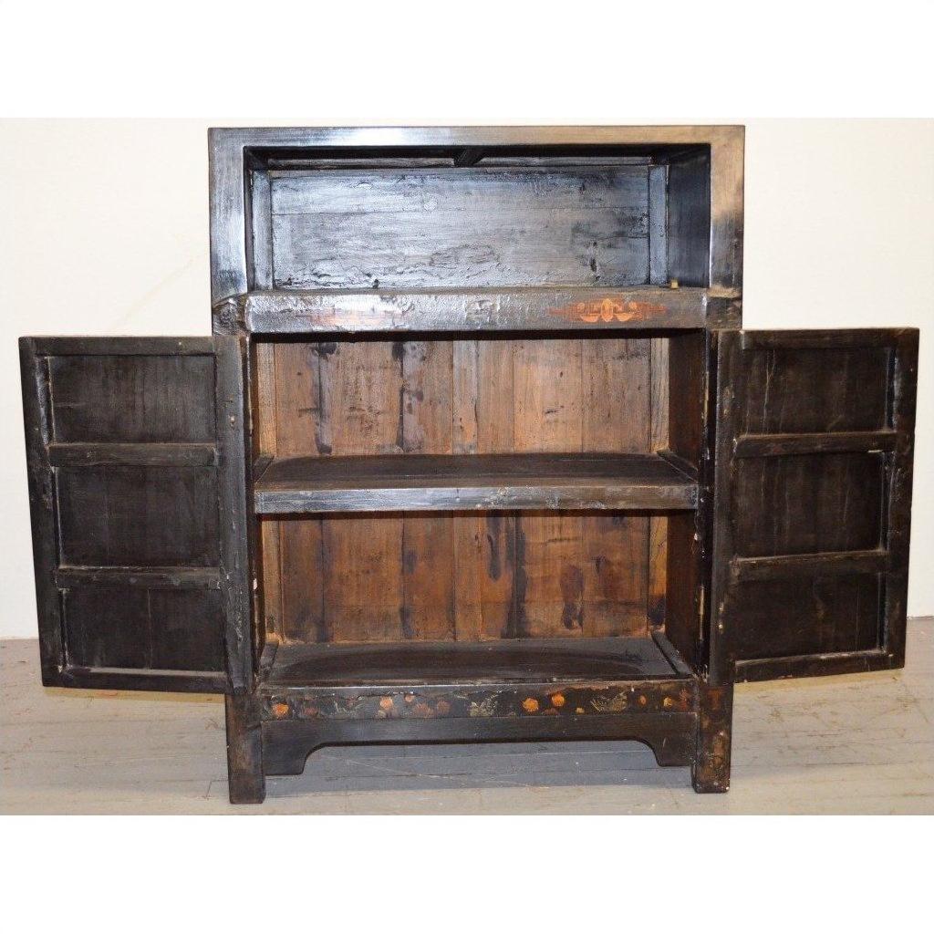 Wood display cabinets with two open lower doors and shelves, empty compartments visible, indoors.
