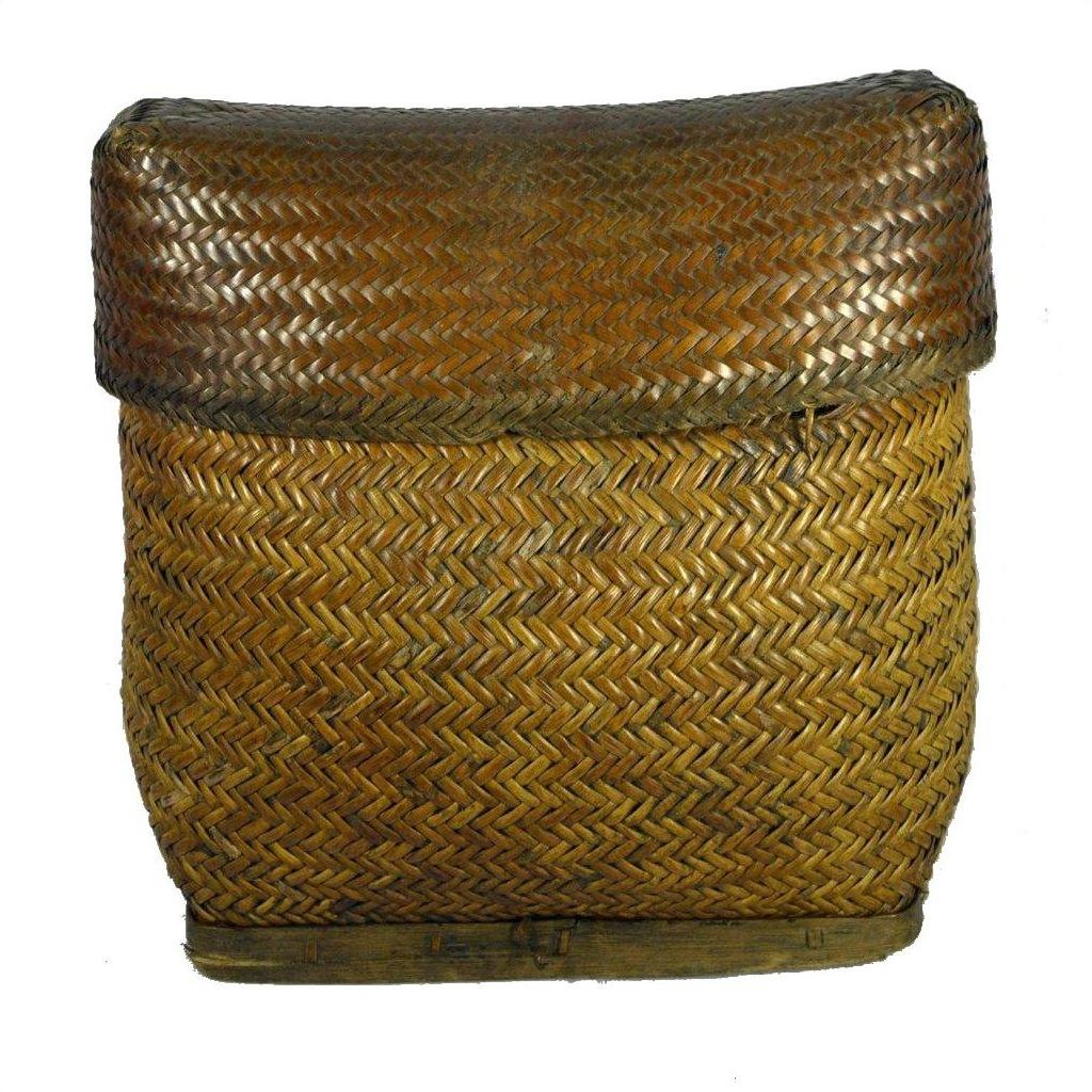 Brown rattan rectangular basket with fitted lid, tight herringbone weave, close-up view.