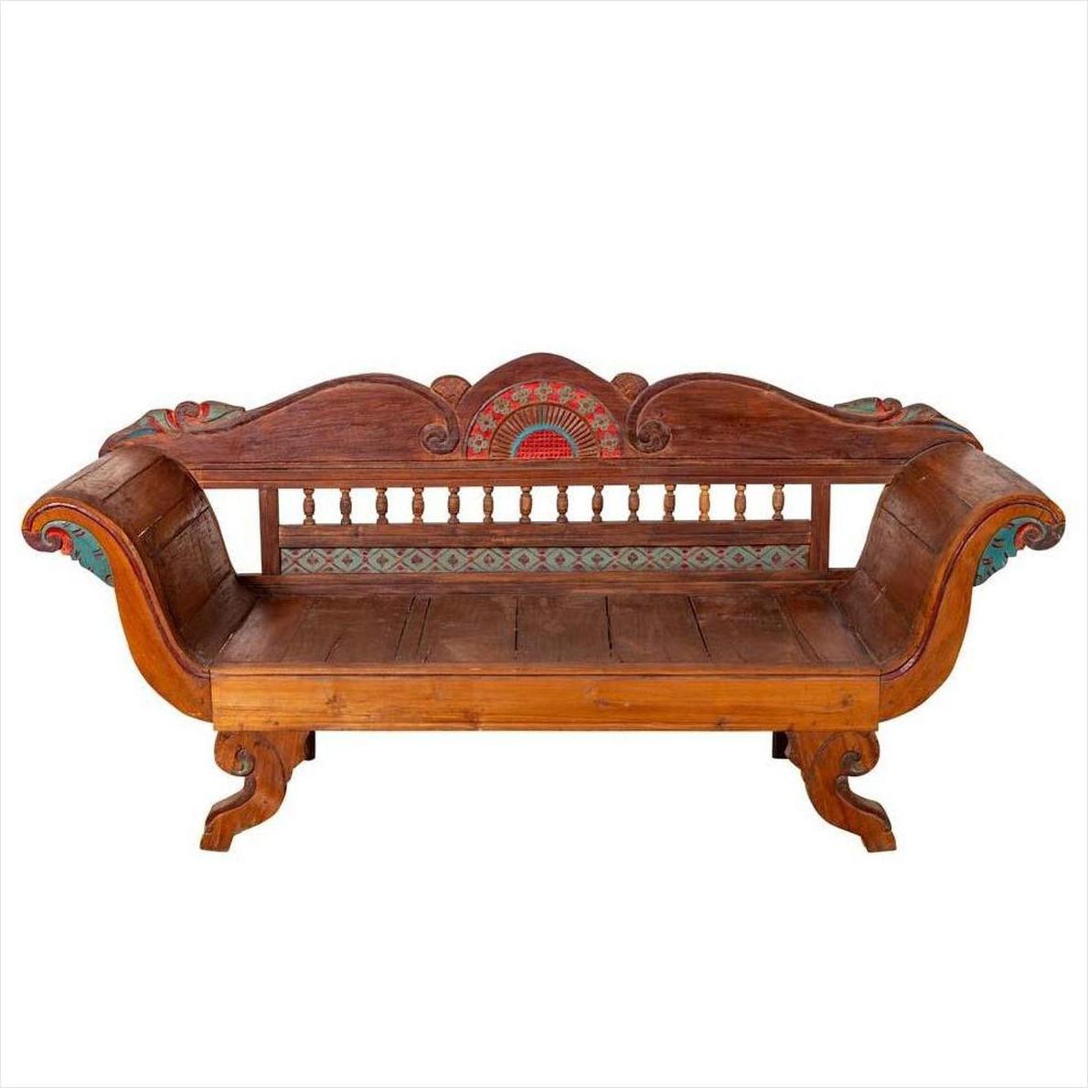 Brown polychrome teak settee with out-scrolling arms, classic style, indoor setting.