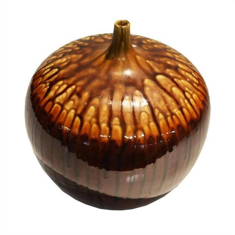 Brown and tan ceramic jar with narrow neck, artisan style, close-up against white background.