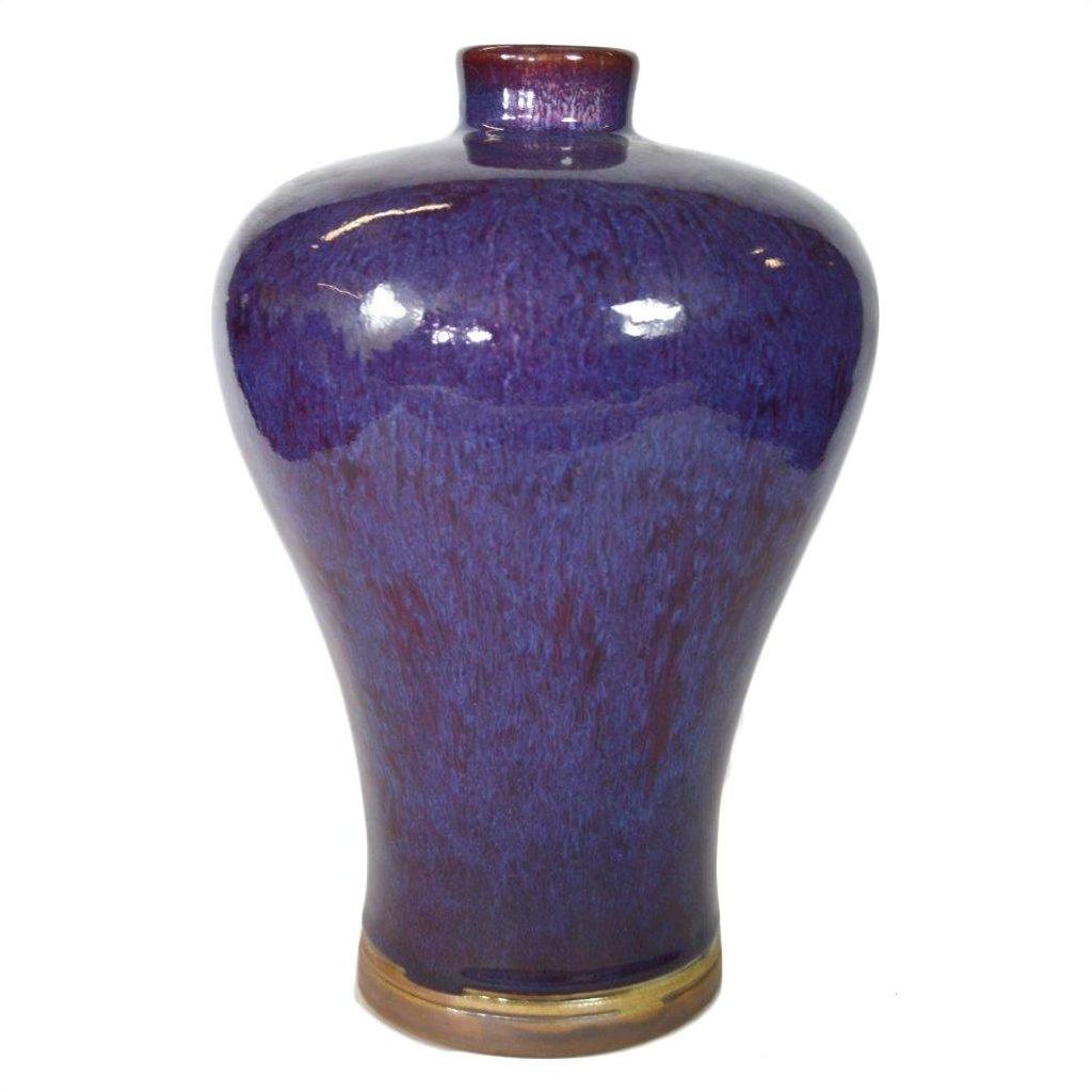Close-up of glossy purple ceramic vase with narrow neck and rounded shoulders in very good condition.