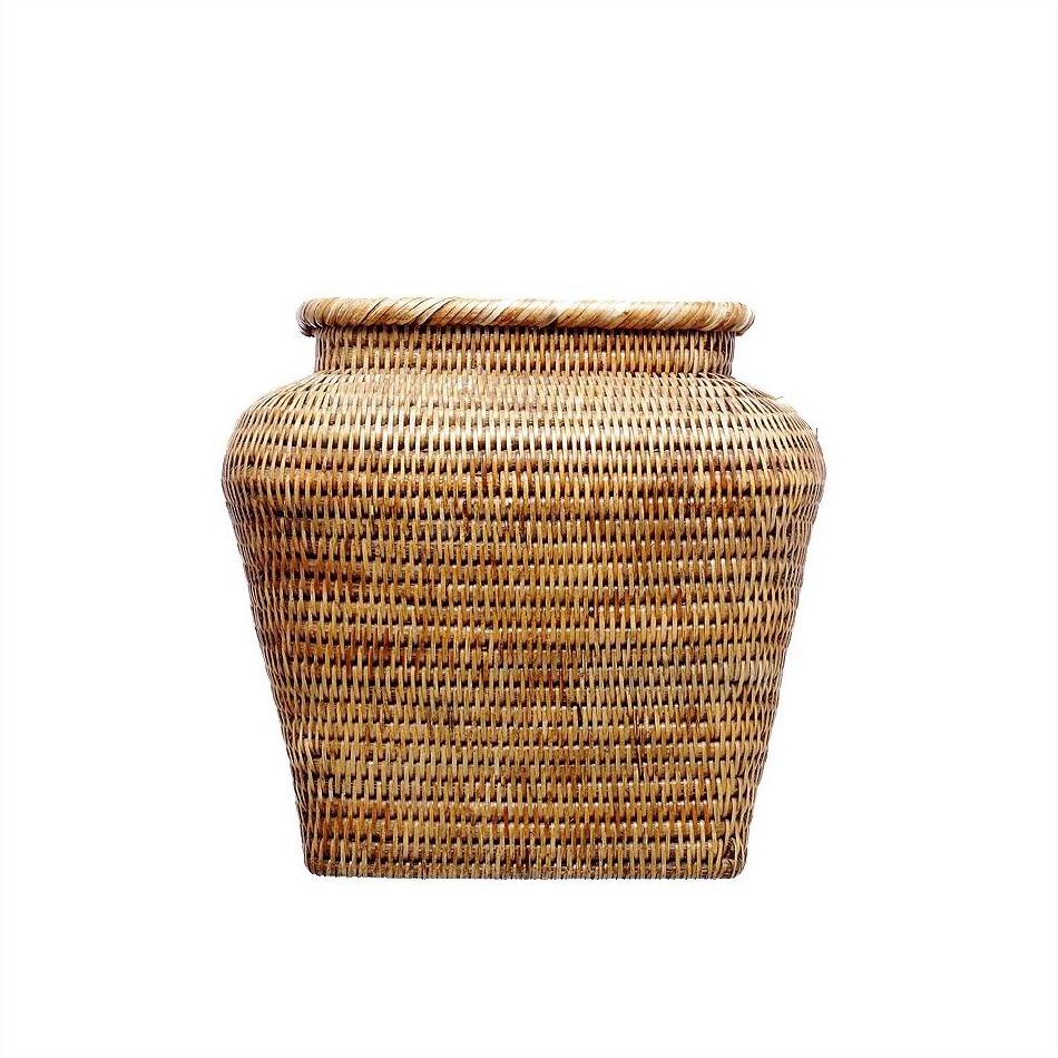 Brown rattan square basket with wide body, tightly woven, on a white background.