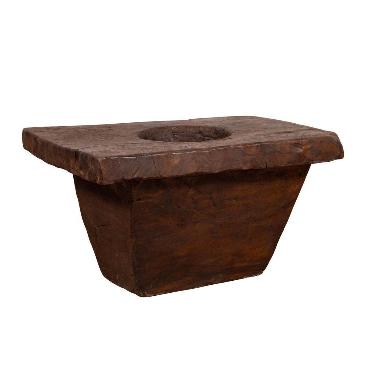 Brown wooden rectangular planter with round hollow center, antique Indonesian style, early 20th century.