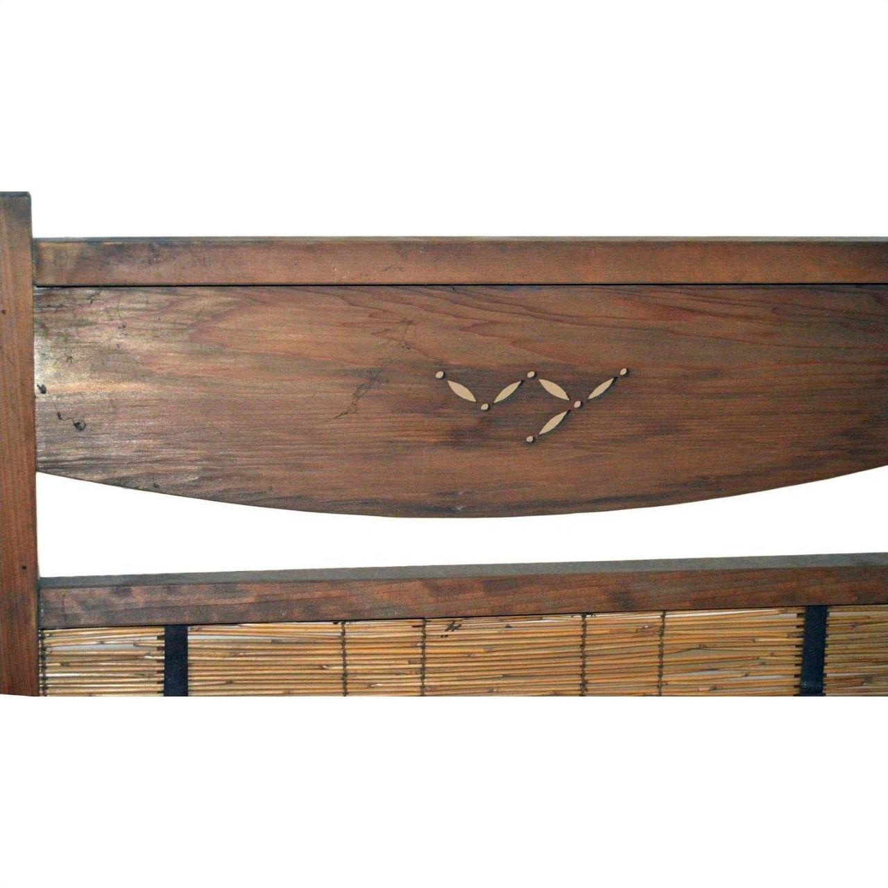 Natural wood screen with curved top, subtle leaf inlay, and bamboo panel detail at the bottom.