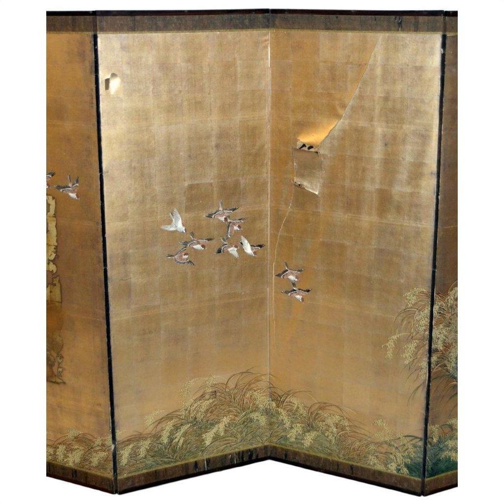 Gold painted screen with birds and grasses, large tear in upper right panel, AS IS condition.