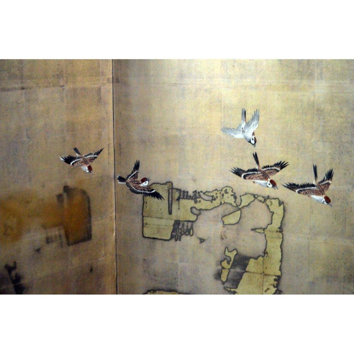 Golden architectural screen with six birds in flight, sold as is.