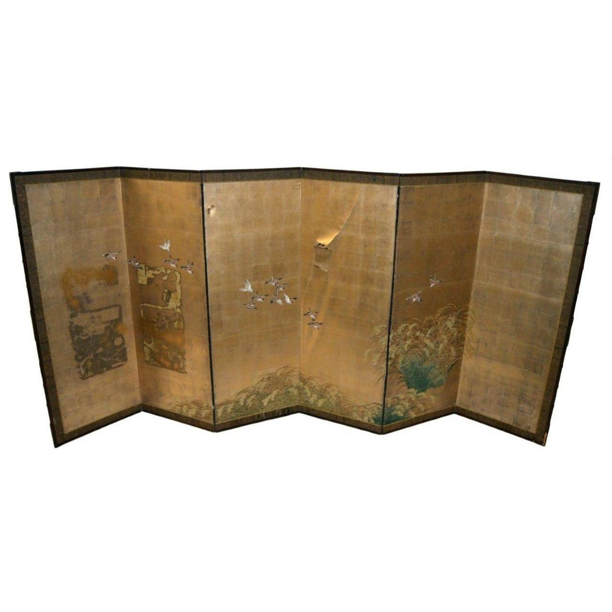 Gold leaf Japanese folding screen with painted cranes in flight and landscape, price tag visible.