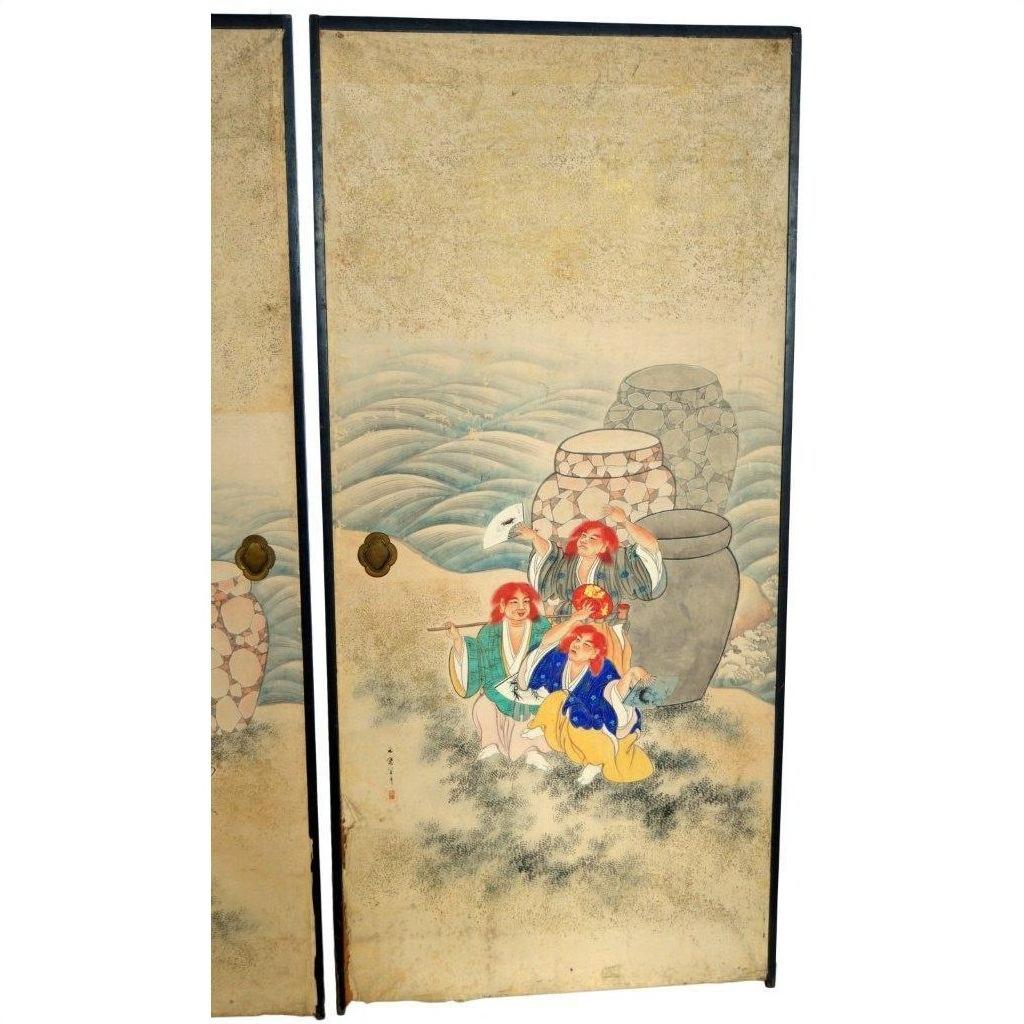 Gold and black vintage Japanese 2-panel screen with four robed figures, crane, jars, and wave or hill motifs in background.