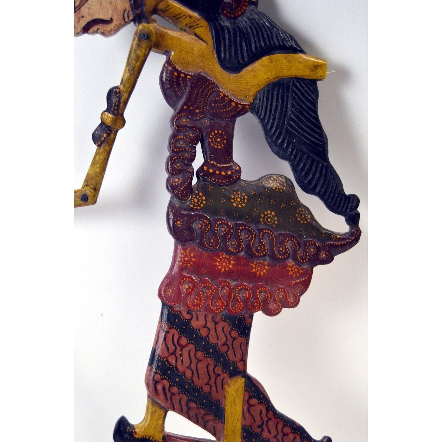 Wooden Wayang Kulit shadow puppets with traditional detailed designs, set of 3, in assorted vibrant colors.