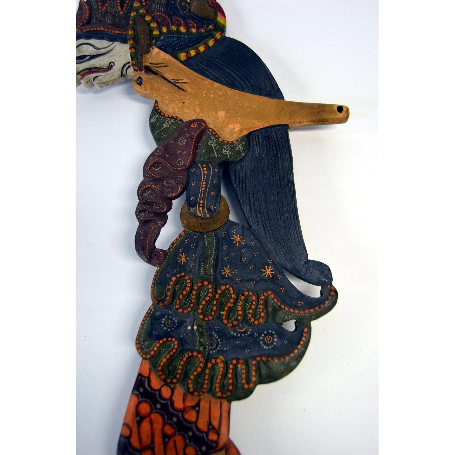 Colorful wooden Wayang Kulit shadow puppets with ornate patterns, set of 3, displayed together.