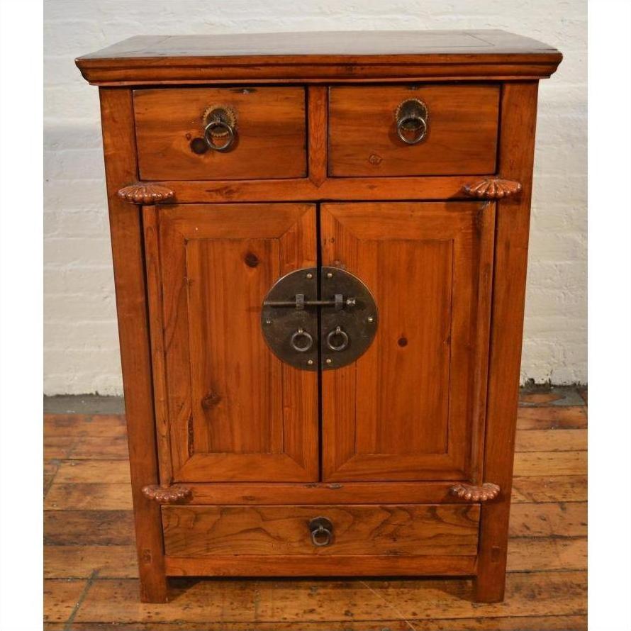 Brown wood side cabinet with metal ring handles, two top drawers, center double doors, and a bottom drawer.