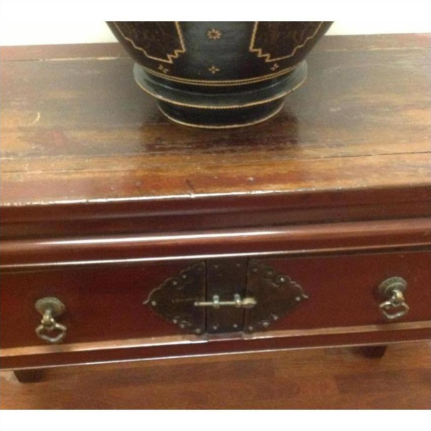 Brown wood console table with horse hoof legs, metal handle drawers, and a decorative dark bowl on top.