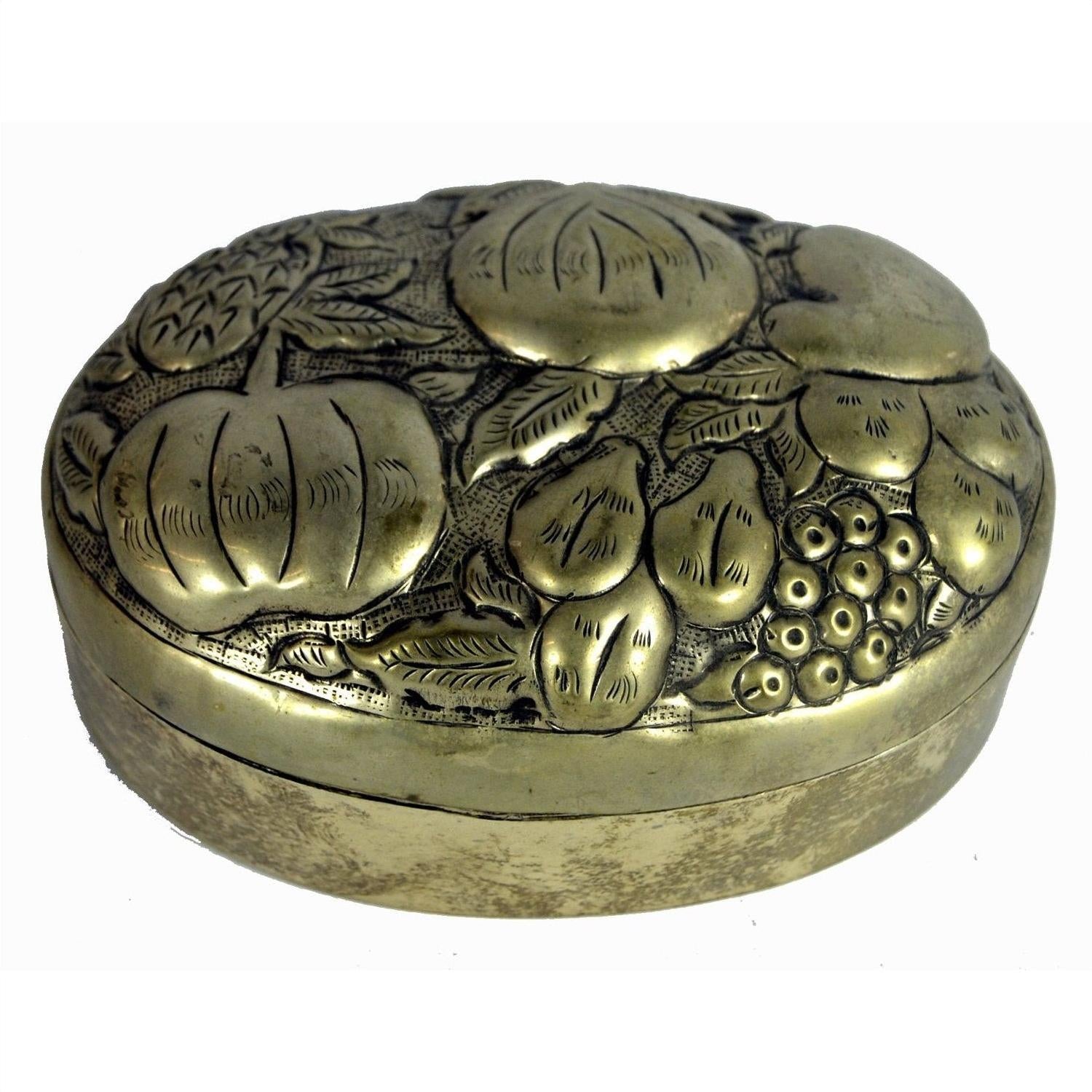 Silver plate jewelry box with embossed pumpkins, pears, and berries on oval lid, close-up view.