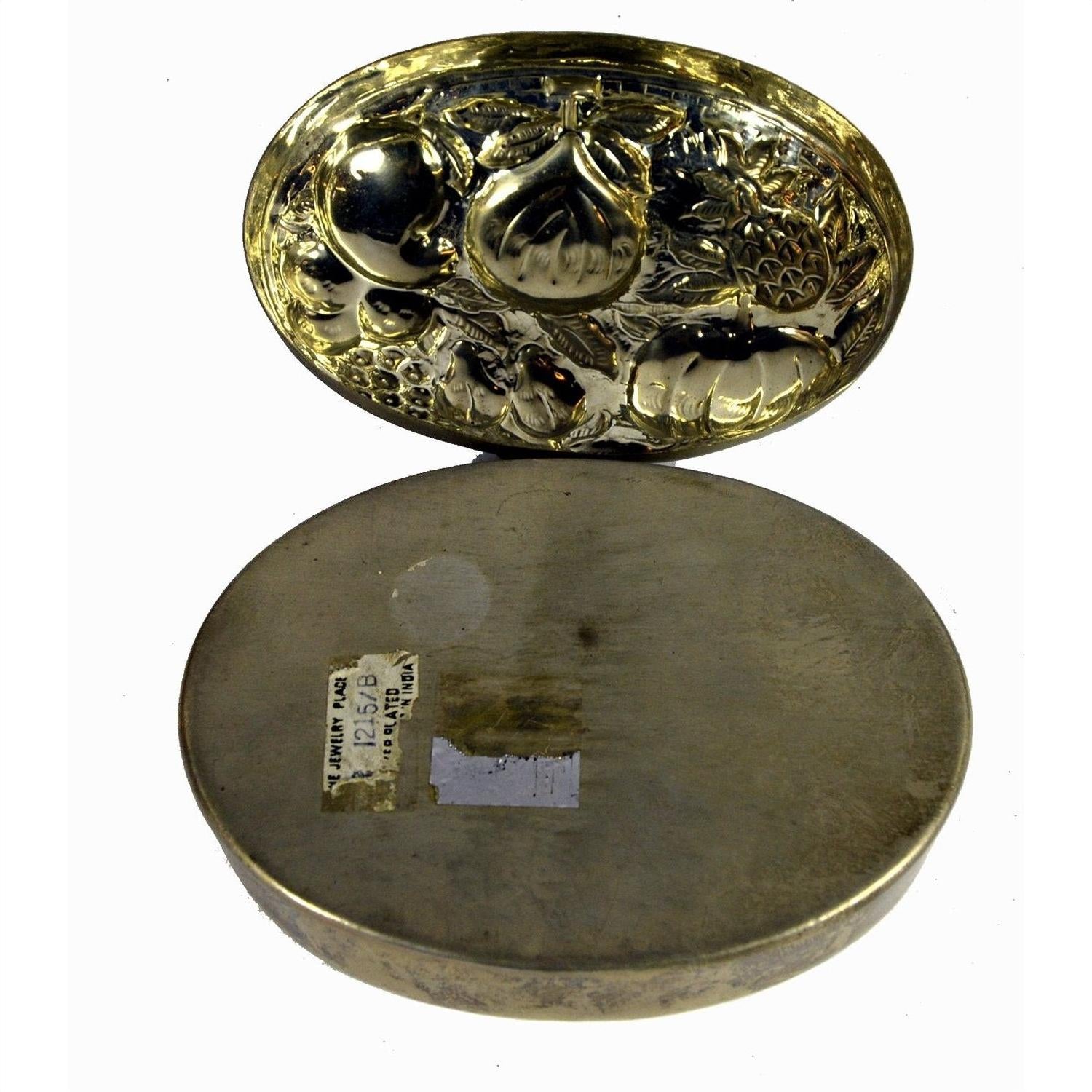 Silver plate jewelry box with lid, embossed fruit design, base shows paper labels and visible wear.