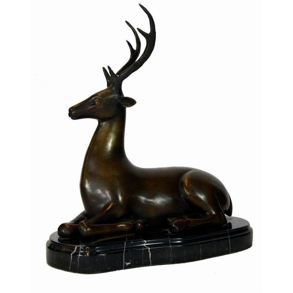 Bronze sitting deer sculpture with antlers on a marble base, displayed against a plain white background.