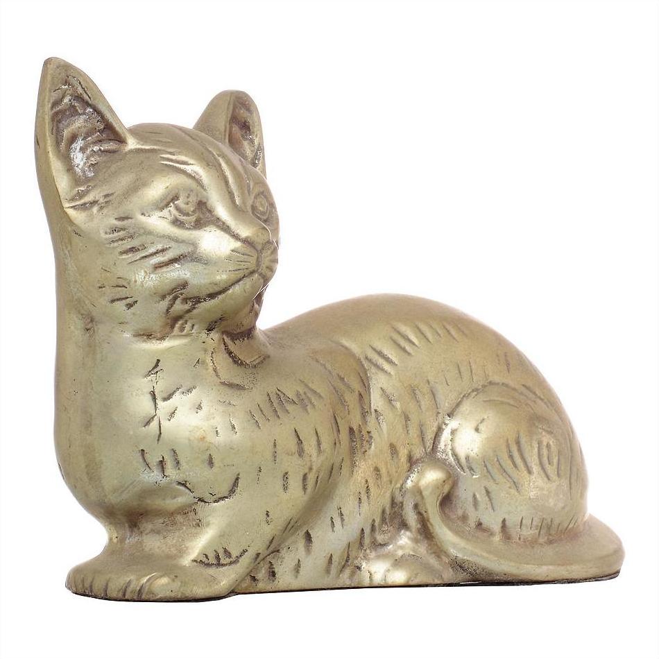 Brass cat figurine with engraved fur and alert ears, seated, close-up against plain background.
