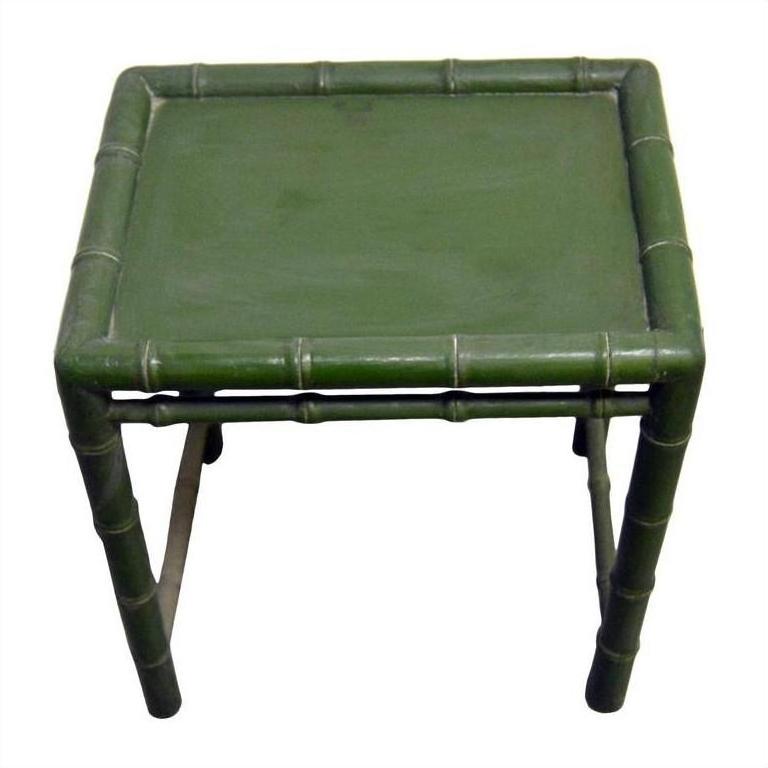 Green bamboo side table with bamboo-inspired legs and edges, shown against a plain background.