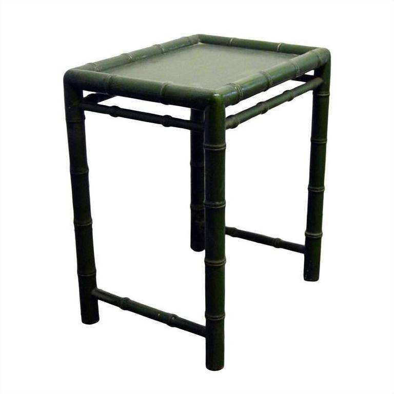Close-up of small green bamboo side table with square shape and bamboo-style legs and edges.