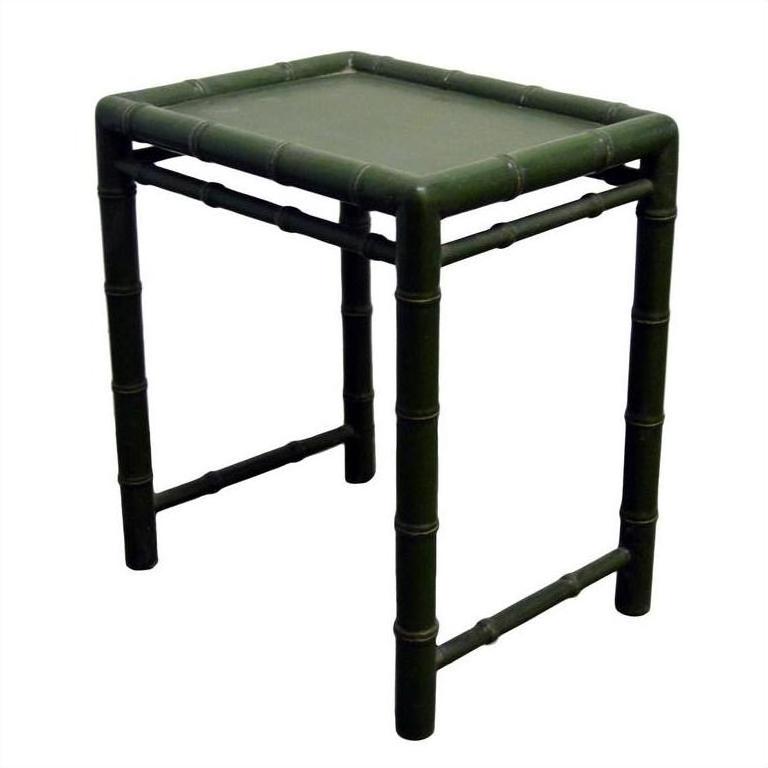 Close-up of small green bamboo side table with square top and bamboo-style legs and frame.