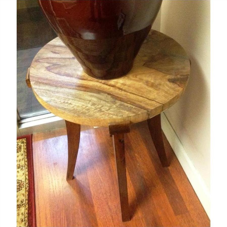 Brown mango wood round table with 19" wood-grained top and three legs, shown for corner or decor use.