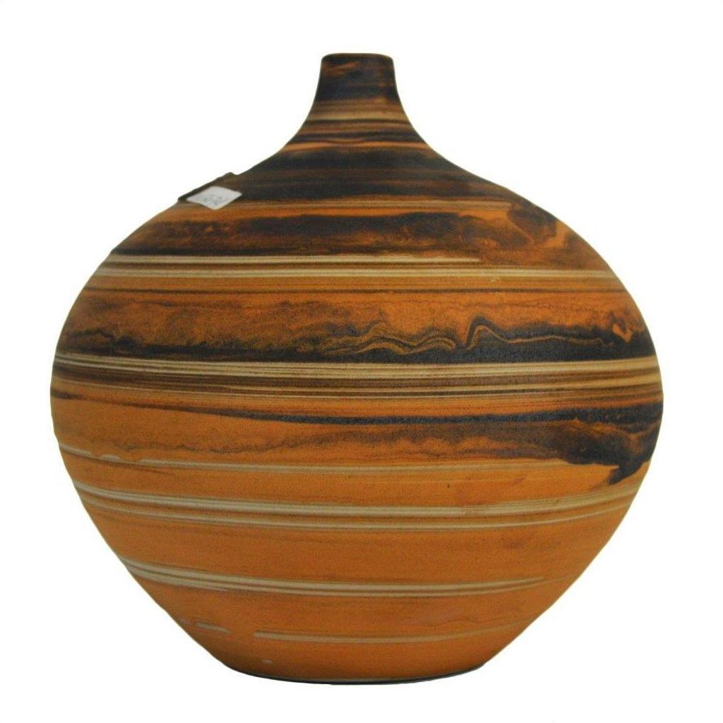 Close-up of orange and black ceramic vase with narrow neck and artisan striped patterns.