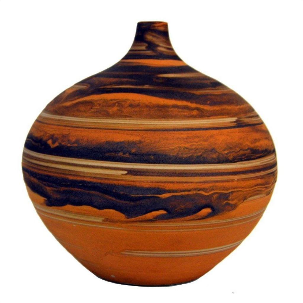 Close-up of small round vase with orange and black marbled design and a narrow neck, ceramic texture visible.