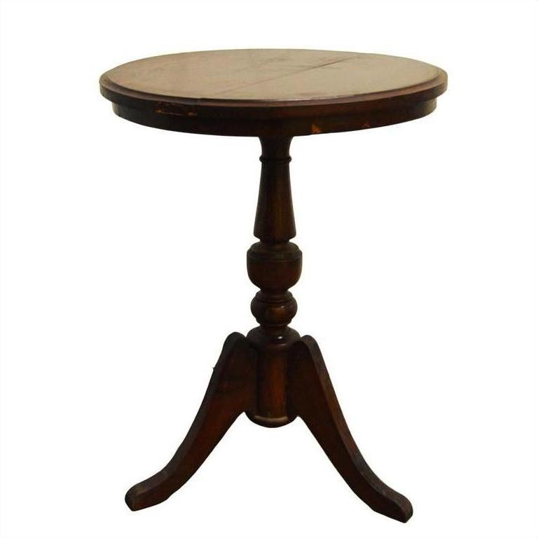 Brown wooden round table with pedestal base and three curved legs, suitable for small or corner spaces.