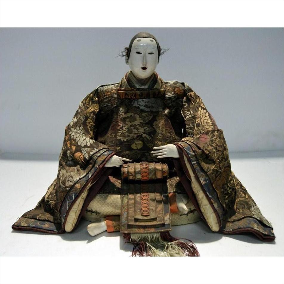 Brown fabric samurai doll in kimono and scarf, front view.