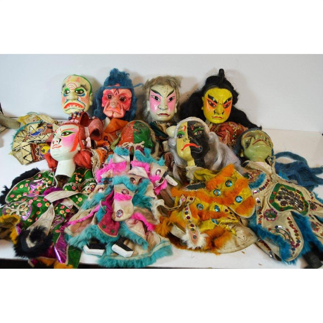 Colorful fabric Taiwan Opera dolls with ornate costumes, displayed on a white surface, close-up view.
