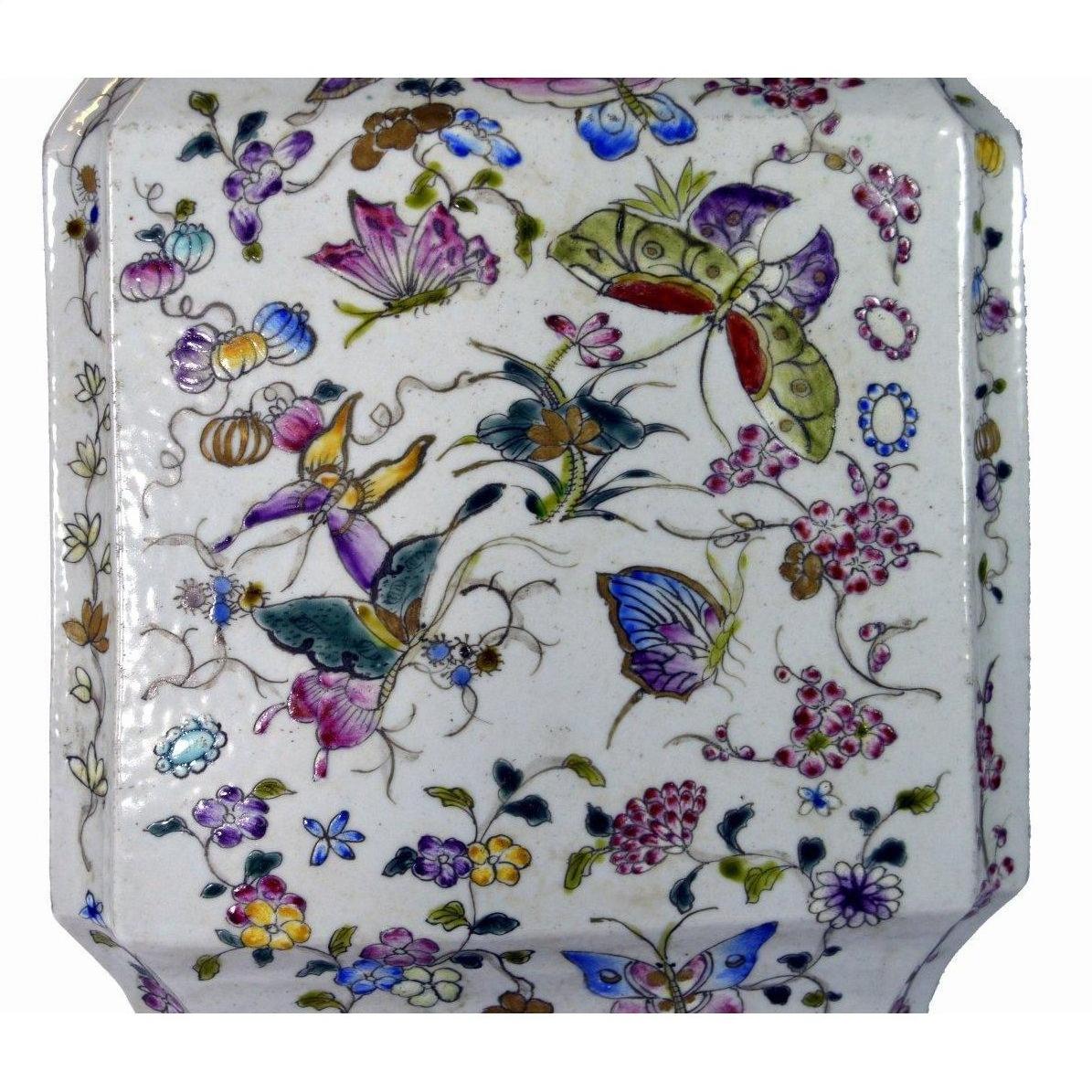 White porcelain vase with hand-painted butterflies and floral design, tall shape, shown against a plain background.