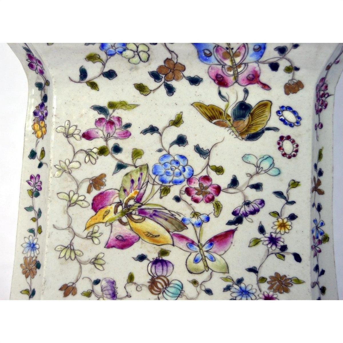 White porcelain vase with hand painted colorful birds, butterflies, and floral designs, shown on white background.