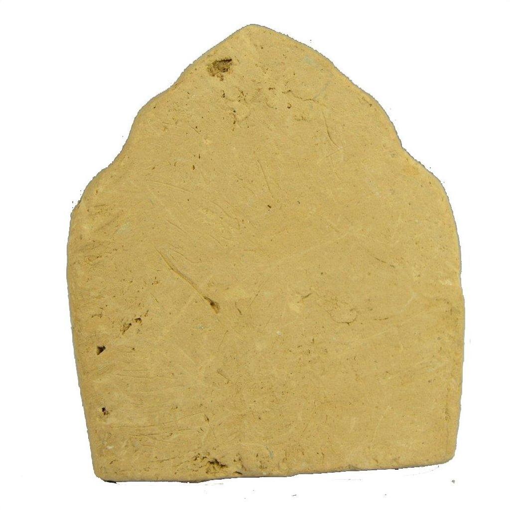Beige terracotta Thai miniature shrine with arched top and uneven surface on a white background.