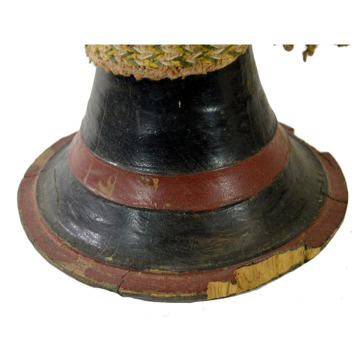 Close-up of the base of a black and red wood Thai Tribal Bongo Drum with visible cracks and worn edges.