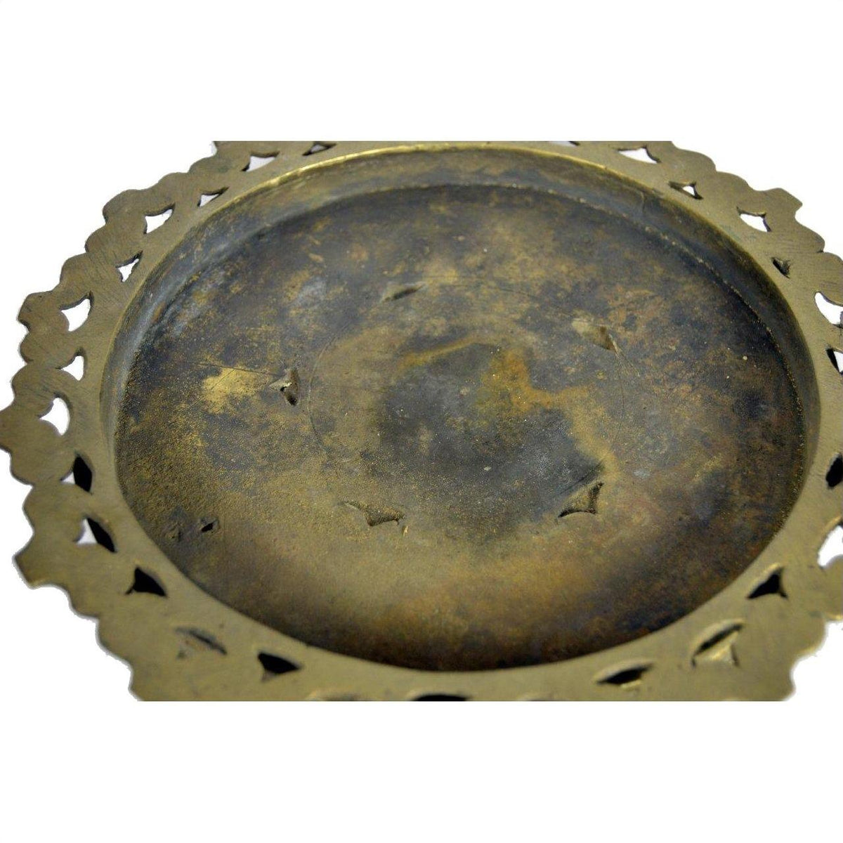 Close-up of a darkened brass Betel Nut box with tiered layers and a decorative cut-out border.