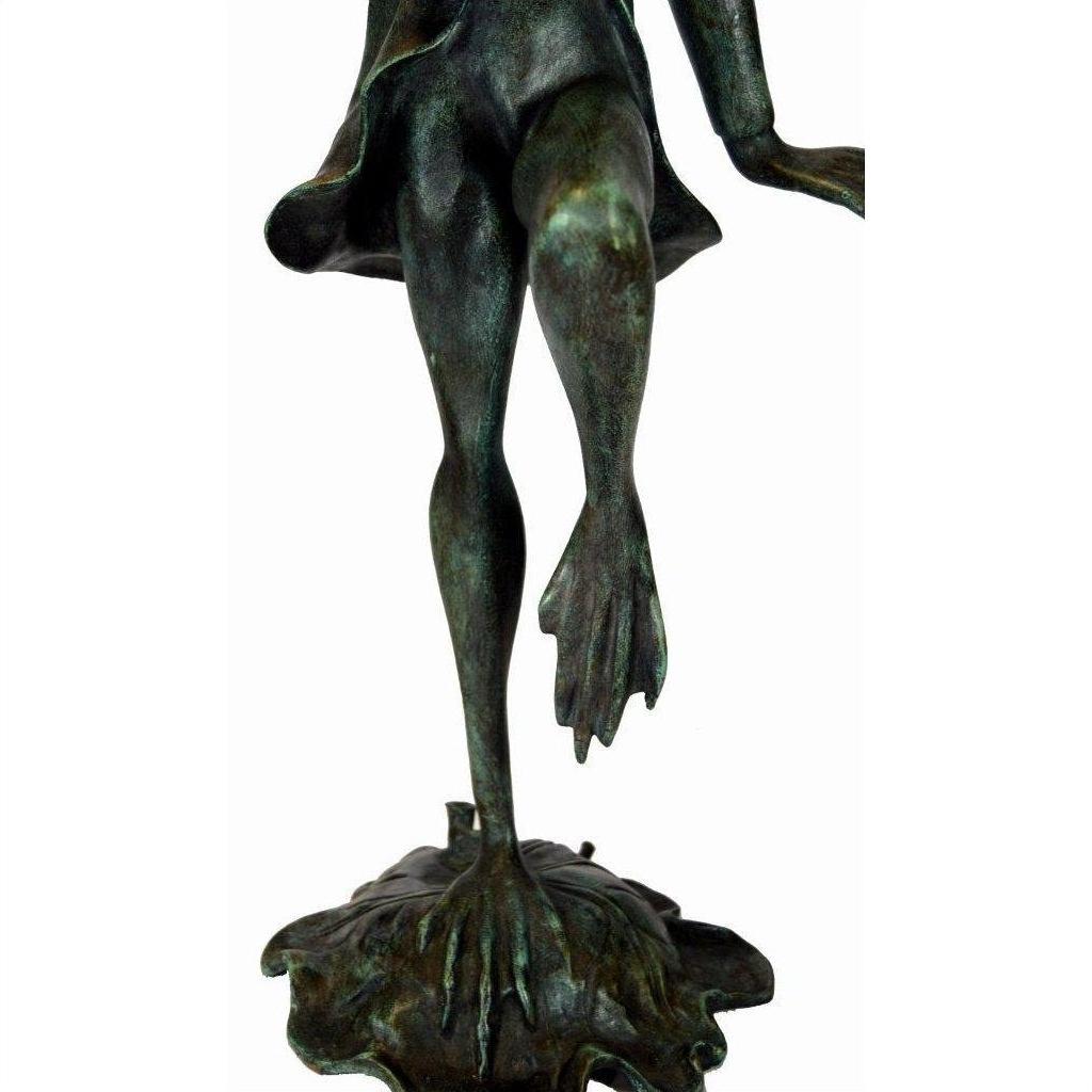 Verde gris bronze frog sculpture with webbed feet on one leg, standing on a textured base.